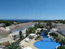 Stunning view from apartment across pools and complex to the sea